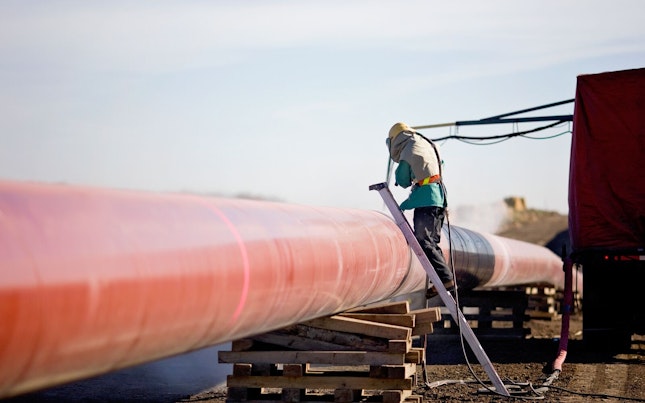 Technician Working on Pipeline
